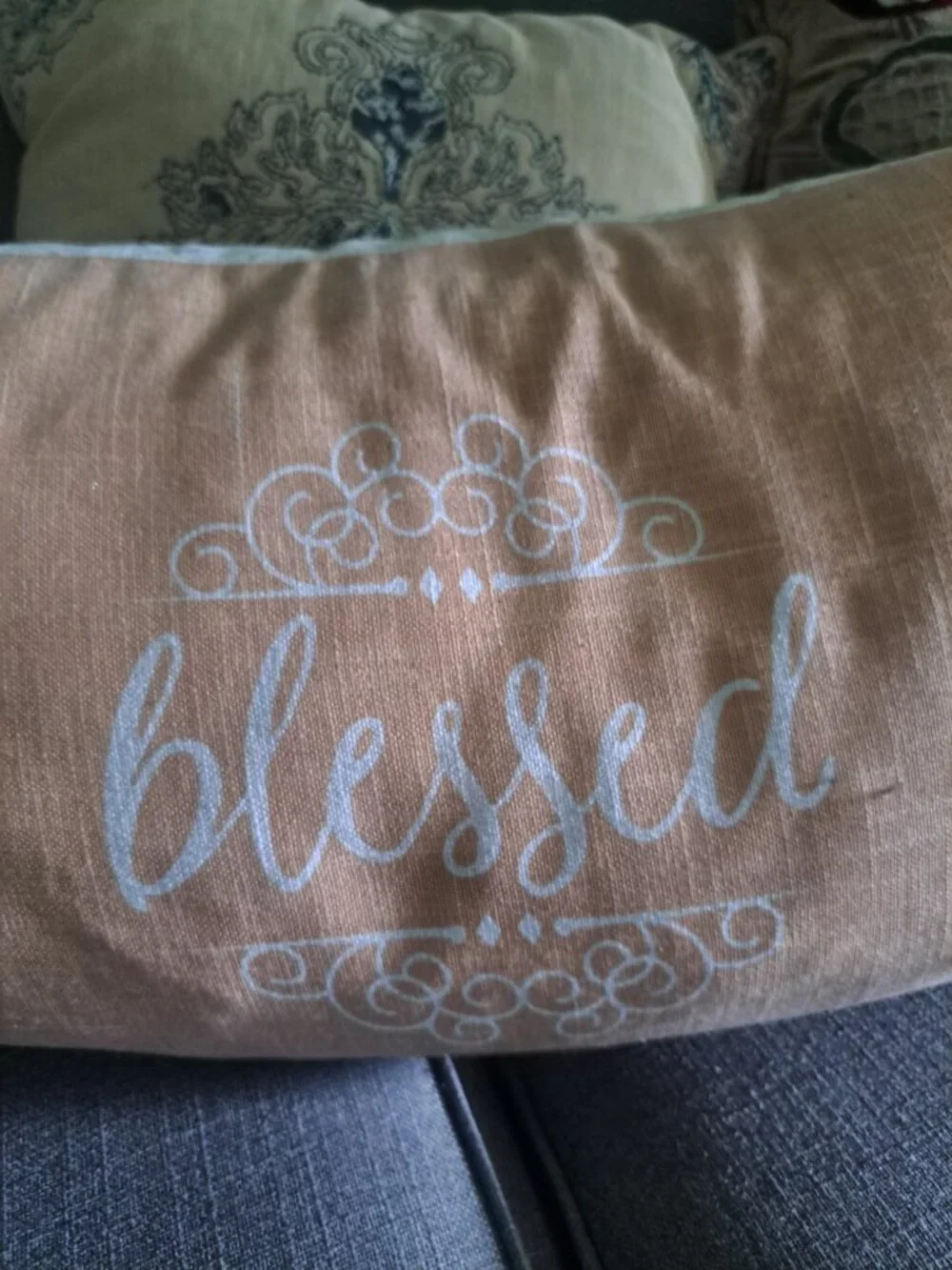 Whimsical rectangular throw pillow has a linen-like fabric base with a printed s